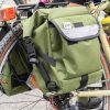 Road Runner Bags Anywhere Panniers - Adventure in Numbers: A group of cyclists equipped with Road Runner Bags Anywhere Panniers embarking on a bikepacking journey together.