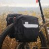Road Runner Bags Anywhere Panniers - Explore with Confidence: A set of bikepacking bags securely mounted on a bicycle.
