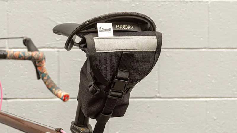 Your Rugged, Road-Ready Ally Pimp your butt with the Road Runner Drafter Saddle Bag when you’re setting off on two wheels. A versatile and sturdy companion for rides anywhere and everywhere, this bike saddle bag is designed for cyclists who need a trio of compactness, capacity, and cool.