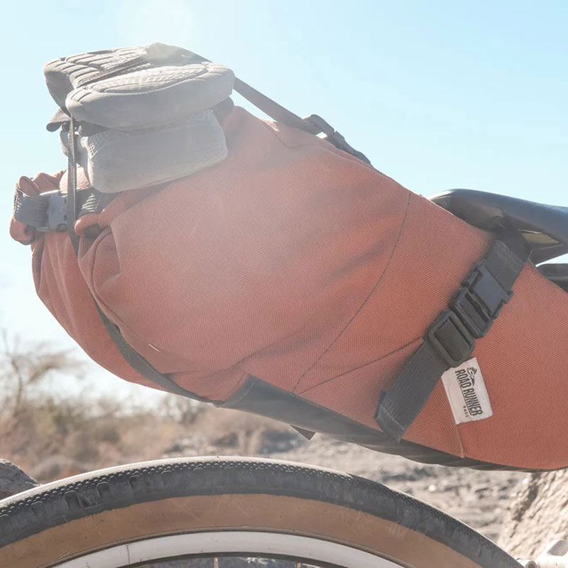 Elevate your bikepacking adventures with the Road Runner Bags Sleeper Saddle Bag – a perfect blend of durability, style, and functionality. Crafted from rugged Cordura fabric, this saddle bag offers generous storage, user-friendly roll-top closure, and versatile attachment options. Ride with confidence and style as you explore the open road with the Sleeper – your ultimate companion for seamless journeys.