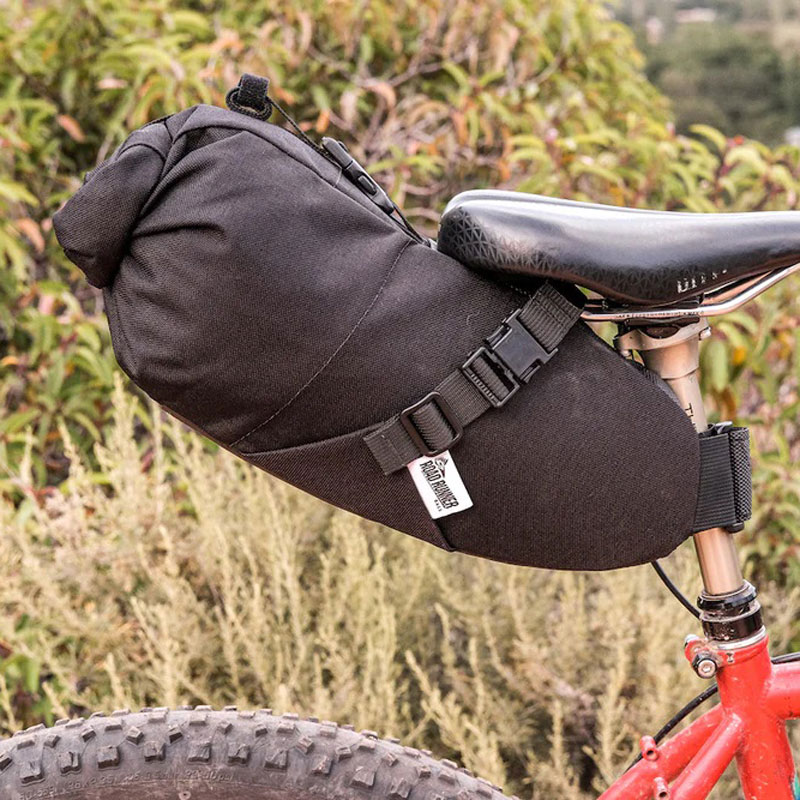 Elevate your bikepacking adventures with the Road Runner Bags Sleeper Saddle Bag – a perfect blend of durability, style, and functionality. Crafted from rugged Cordura fabric, this saddle bag offers generous storage, user-friendly roll-top closure, and versatile attachment options. Ride with confidence and style as you explore the open road with the Sleeper – your ultimate companion for seamless journeys.